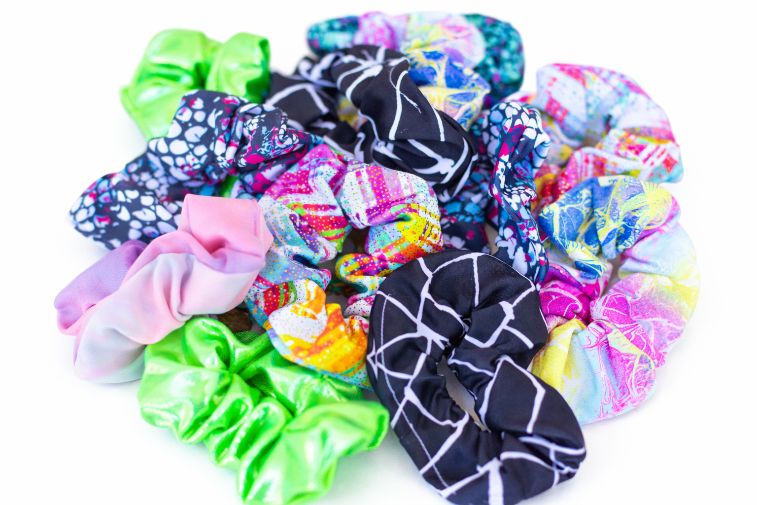 Assorted colorful scrunchies on a white background